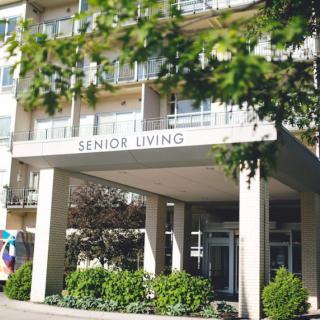 Entrance of a senior living residential building.