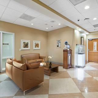A well-designed waiting room with comfortable seating and elegant decor.