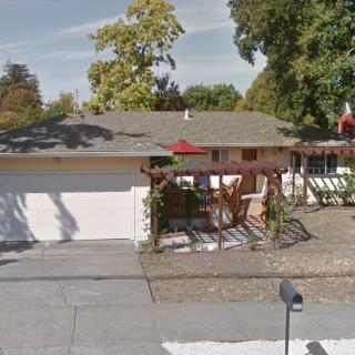 A suburban house with a garage and a small front yard.