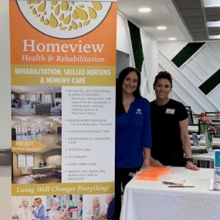Staff members represent Homeview at a healthcare event.