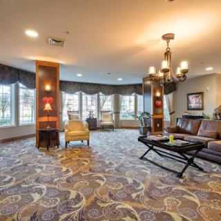 A spacious hotel lobby with comfortable seating areas and elegant lighting.