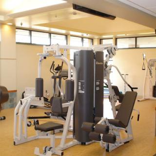 A well-equipped gym featuring various fitness machines for strength training.