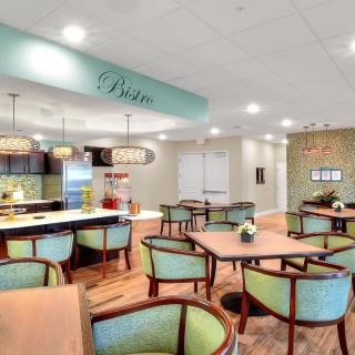A modern dining area with elegant seating and stylish lighting, creating a cozy atmosphere.