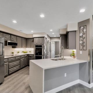 A modern kitchen with sleek appliances and a spacious island.