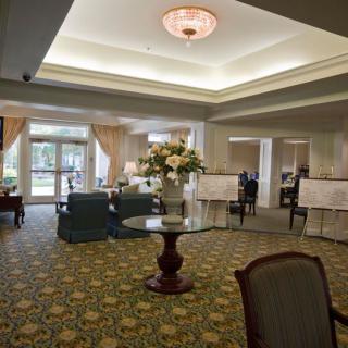 A spacious hotel lobby with elegant decor and comfortable seating.