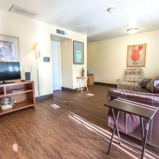 A cozy living room featuring comfortable furniture and warm lighting.