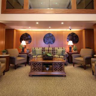 A cozy living room with comfortable seating and warm lighting.
