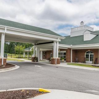 Entrance to a healthcare facility with a covered driveway.