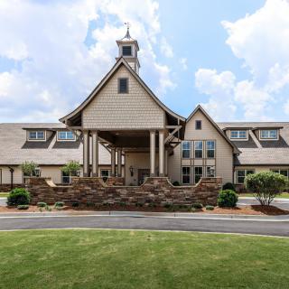 A large suburban house with traditional architecture and a welcoming entrance.