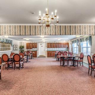 A spacious dining room with elegant decor and ample seating.