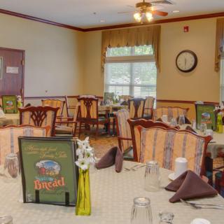 Cozy restaurant dining area with neatly arranged tables and chairs.