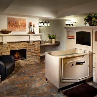 A luxurious bathroom with a walk-in bathtub and a cozy fireplace.