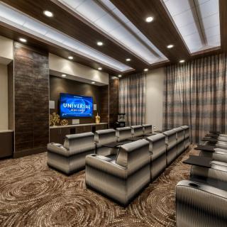 A luxurious home theater with plush seating and ambient lighting.