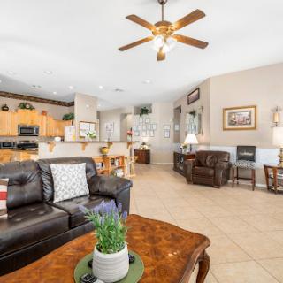 A cozy and inviting living room featuring comfortable furniture and an open layout.