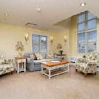 A cozy living room with comfortable seating and large windows.
