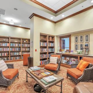 A cozy library interior with bookshelves and a comfortable reading area.