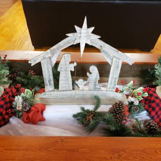 A beautifully arranged nativity scene adorned with festive decorations.