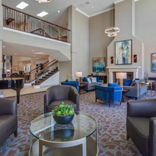 A modern and spacious lobby featuring comfortable seating areas and stylish decor.