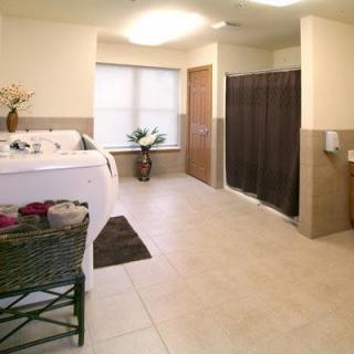 A spacious and modern bathroom featuring a bathtub and shower.