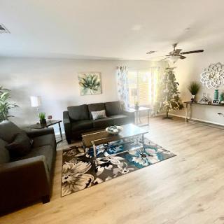 A beautifully designed living room showcasing modern furniture and a warm, inviting atmosphere.