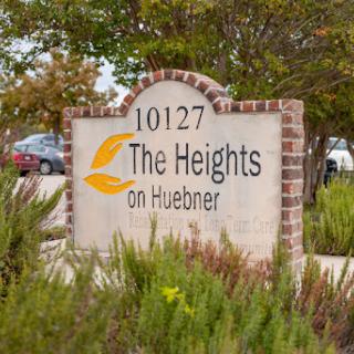 Entrance sign for The Heights on Huebner, marking a residential community.