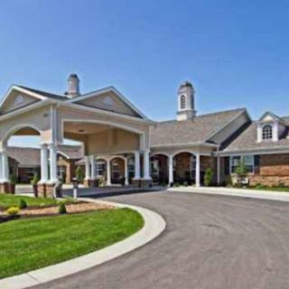 The inviting entrance of a beautifully designed residential building on a clear sunny day.