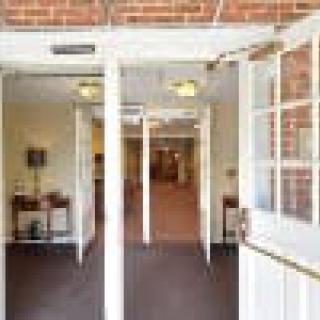 Open doorway leading into a building's hallway.