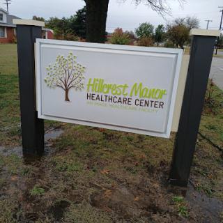 Sign for a healthcare center featuring a tree design.