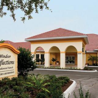 A well-designed building with an inviting entrance and landscaped surroundings.