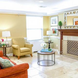 A cozy living room with comfortable seating and elegant decor.