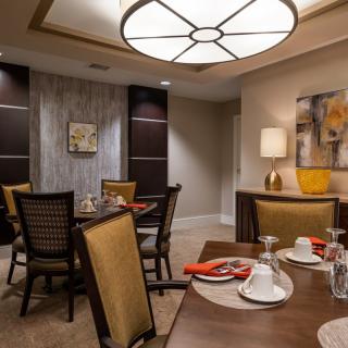 A sophisticated dining room with elegant furnishings and contemporary decorations.