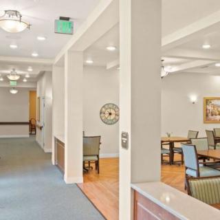 A modern dining area with elegant lighting and comfortable seating.