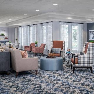 A modern lobby with comfortable seating and stylish decor.