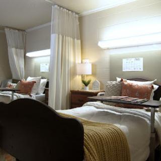 A cozy and modern bedroom featuring twin beds with elegant decor and soft lighting.