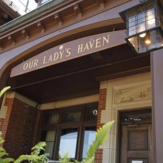 Entrance of Our Lady's Haven showcasing architectural details.