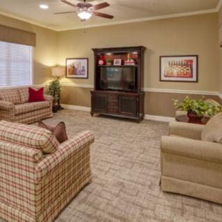 Cozy living room with comfortable seating and a television cabinet.
