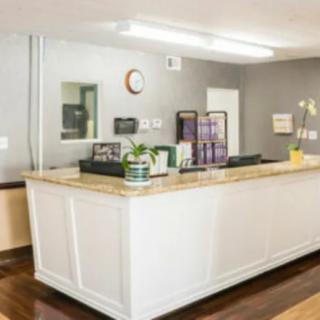 A modern reception desk in an office waiting area.