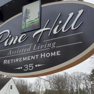 Sign for Pine Hill Assisted Living and Retirement Home.