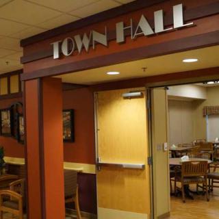 Entrance to a town hall with visible interior seating.