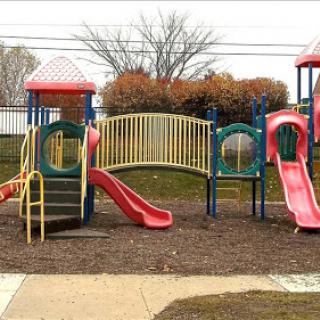 A vibrant playground featuring slides and climbing structures, ideal for children's outdoor activities.