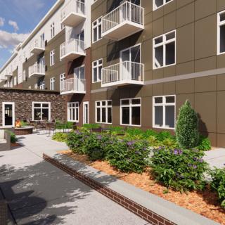 A modern apartment complex with balconies and well-maintained landscaping.