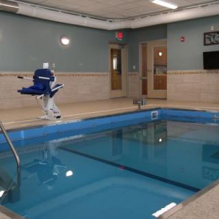 An indoor swimming pool equipped with an accessibility lift.