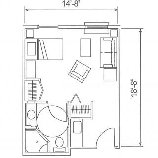 Architectural floor plan of a small room with furniture layout, including bed, chair, and bathroom.