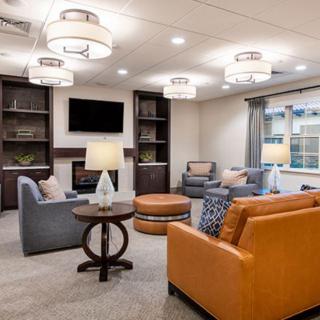 A modern living room with comfortable seating and stylish lighting.