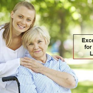A caregiver and an elderly woman enjoying time outdoors together.