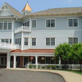 A large residential building with a welcoming entrance and multiple windows.