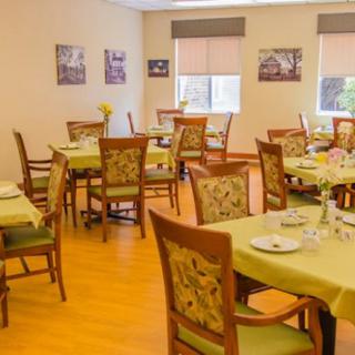 An inviting dining room with neatly arranged tables and chairs, ready for guests.