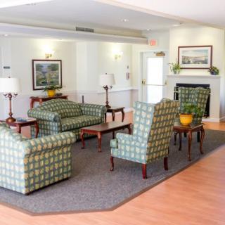 A cozy living room with comfortable seating and elegant decor.