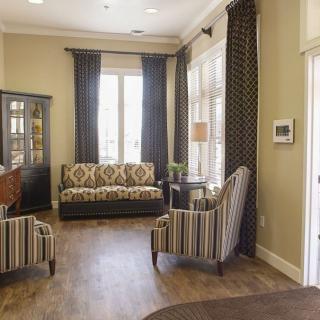 A cozy living room with stylish furniture and ample natural light.