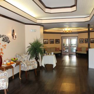 A well-decorated lobby with comfortable seating and soft lighting.